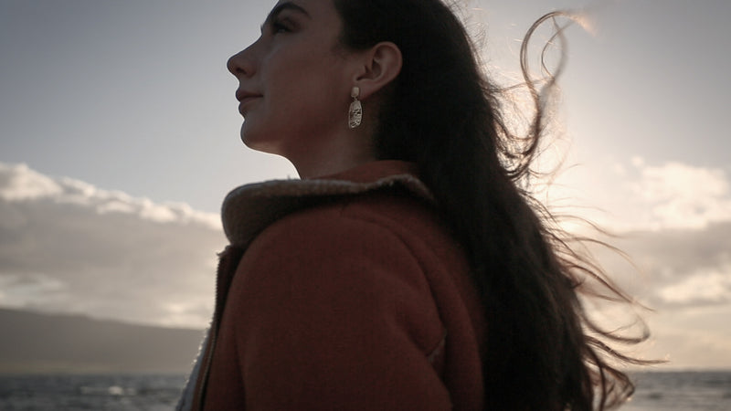 island woman looking out to sea Ola Gorie jewellery earrings 