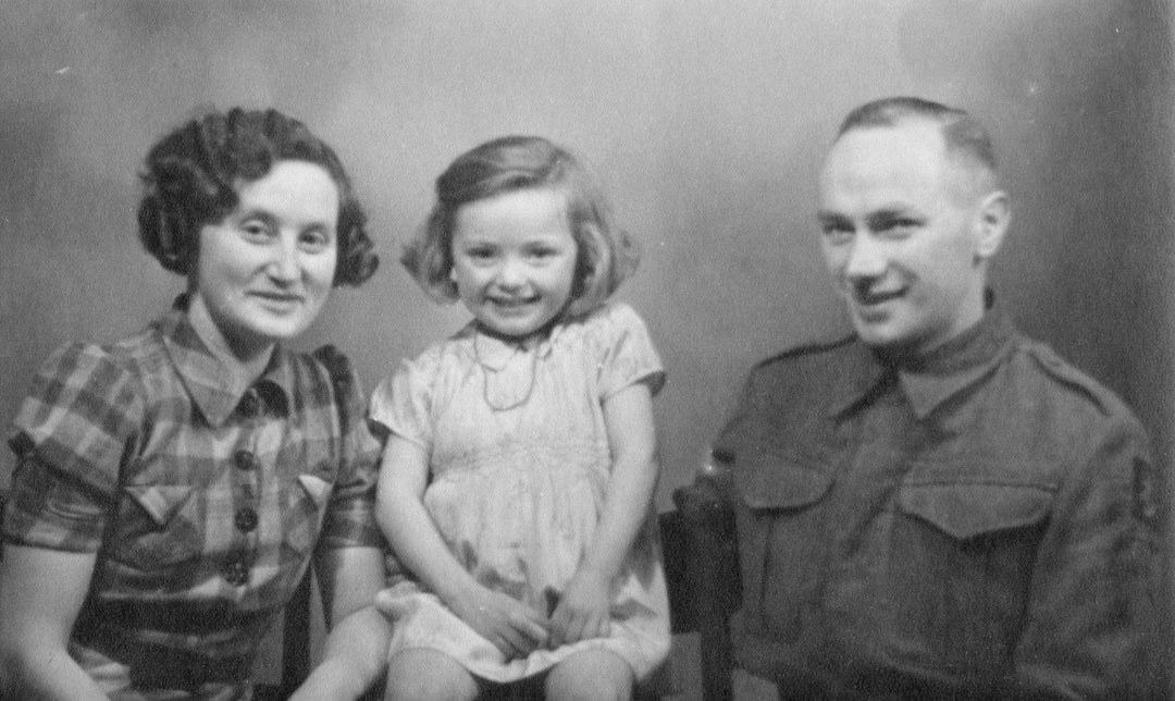 Black and white image of Ola with mum and dad