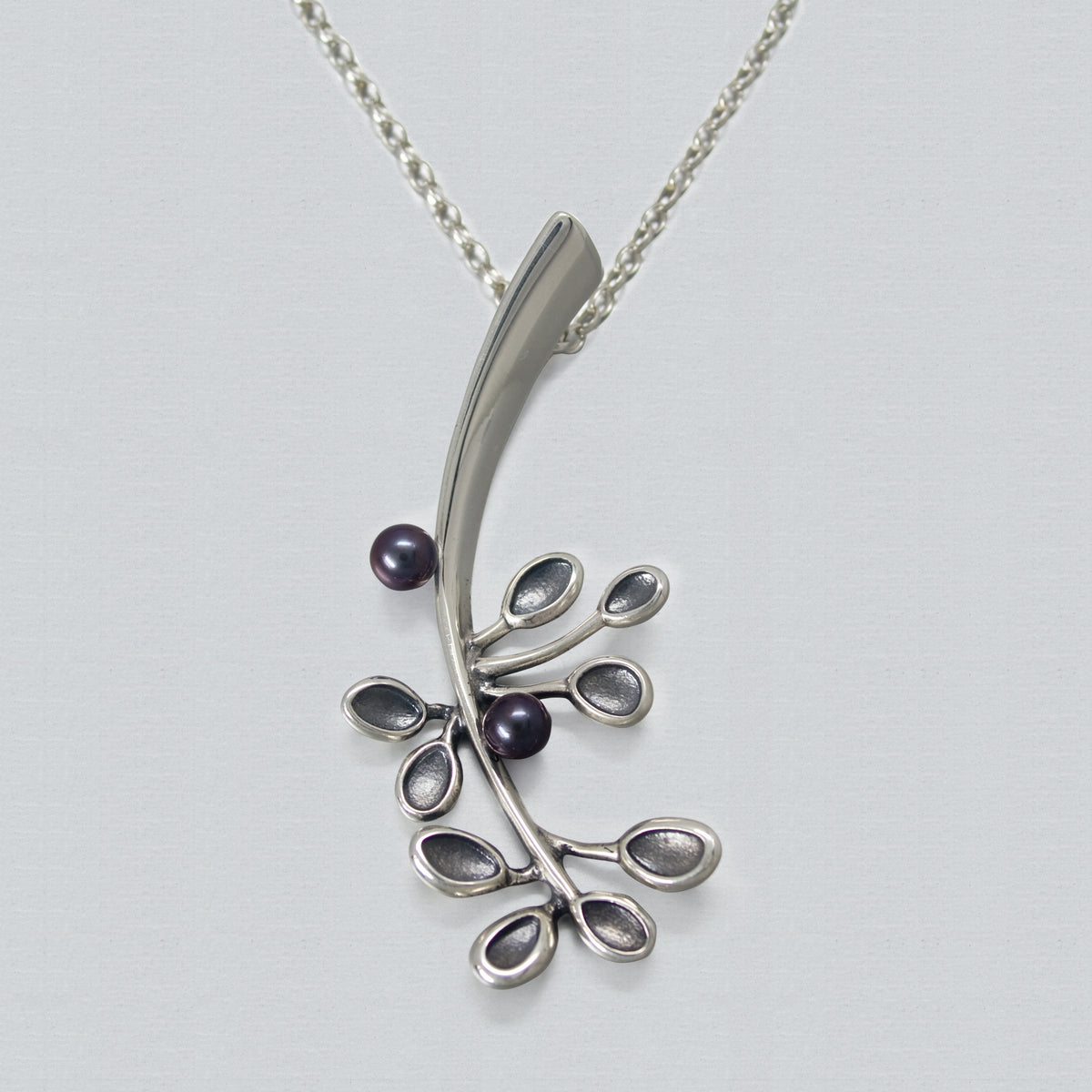 close up of necklace pendant of a flower