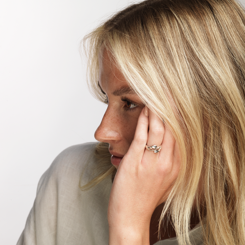 Model wears Ola Gorie silver Cecily ring, inspired by romantic Arts & Crafts design