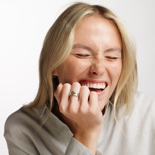 Model wearing Ola Gorie silver Willow ring, Mackintosh style