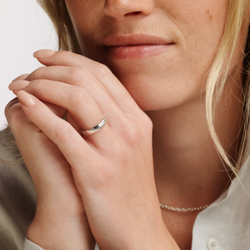 Model wearing Ola Gorie silver Trust Ladies wedding ring    
