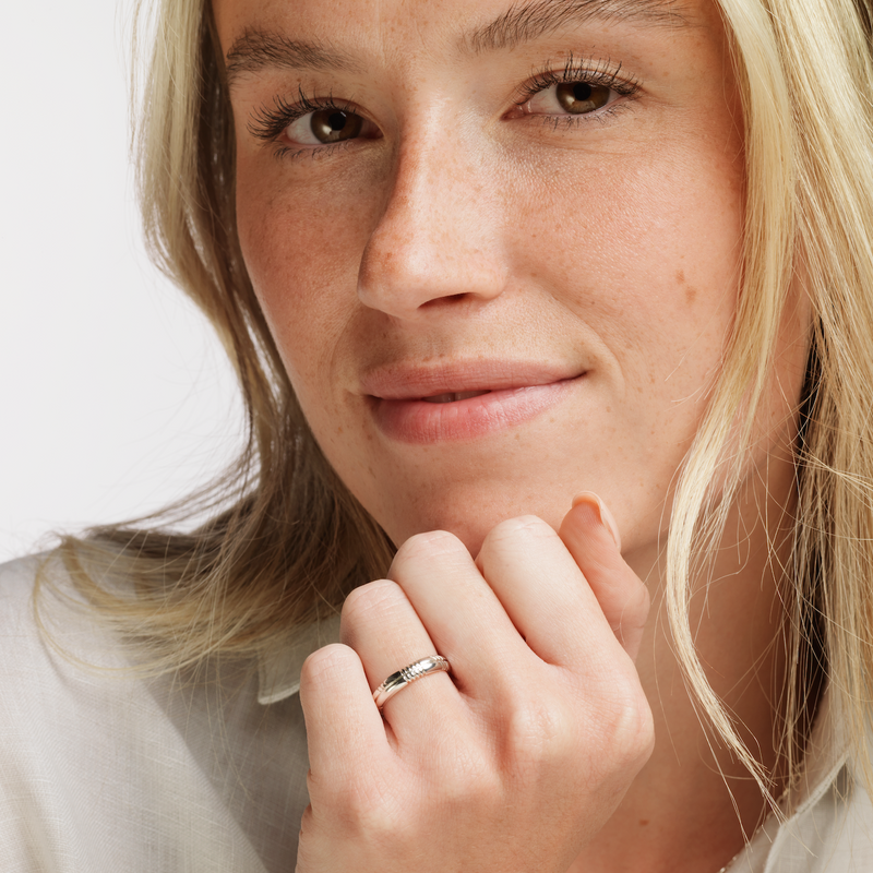 Model wearing Ola Gorie silver Trust Ladies wedding ring               