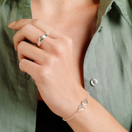 Model wearing Ola Gorie silver Kells Bird ring and bracelet