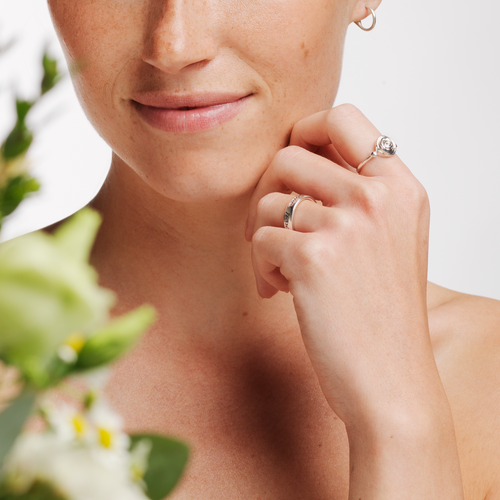 Model wearing Ola Gorie silver Robert Burns ring and other Scottish jewellery