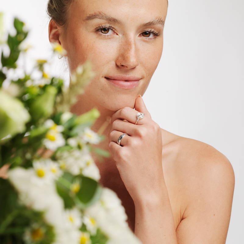 Model wearing Ola Gorie silver Rose ring, and other jewellery