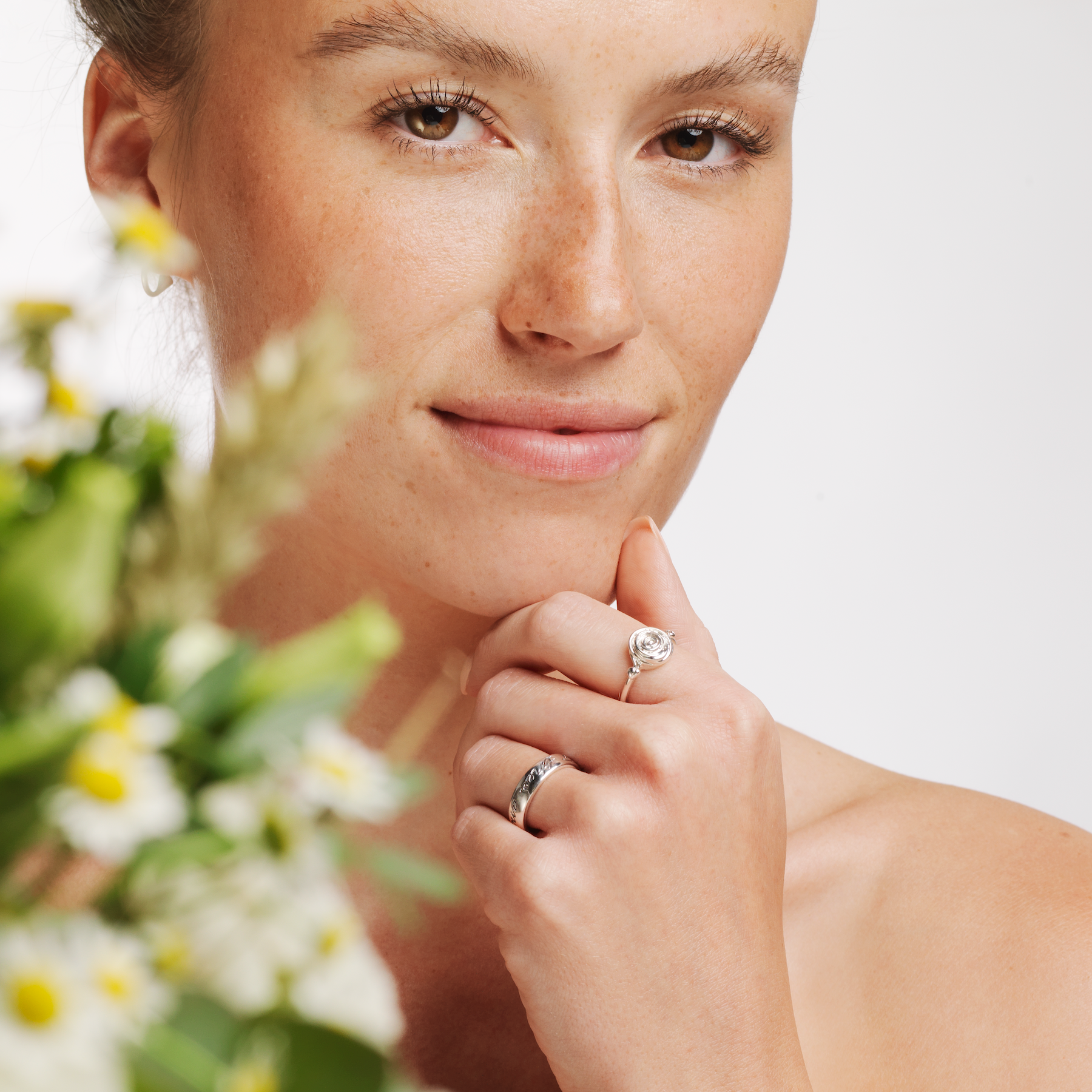 Model wearing Ola Gorie silver Robert Burns ring and other Scottish jewellery