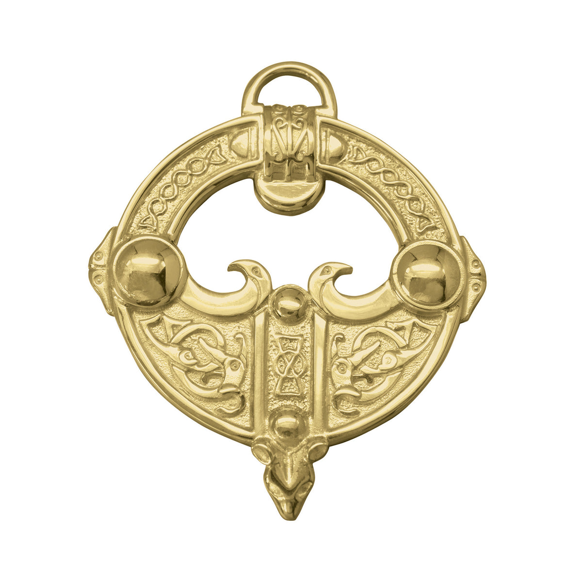 A gold brooch with a intricate celtic design