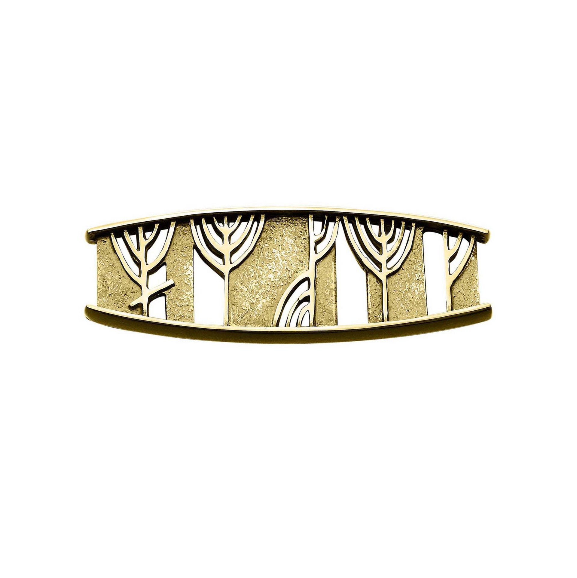 A gold brooch with detailed ruins design from the Ingibiorg Collection