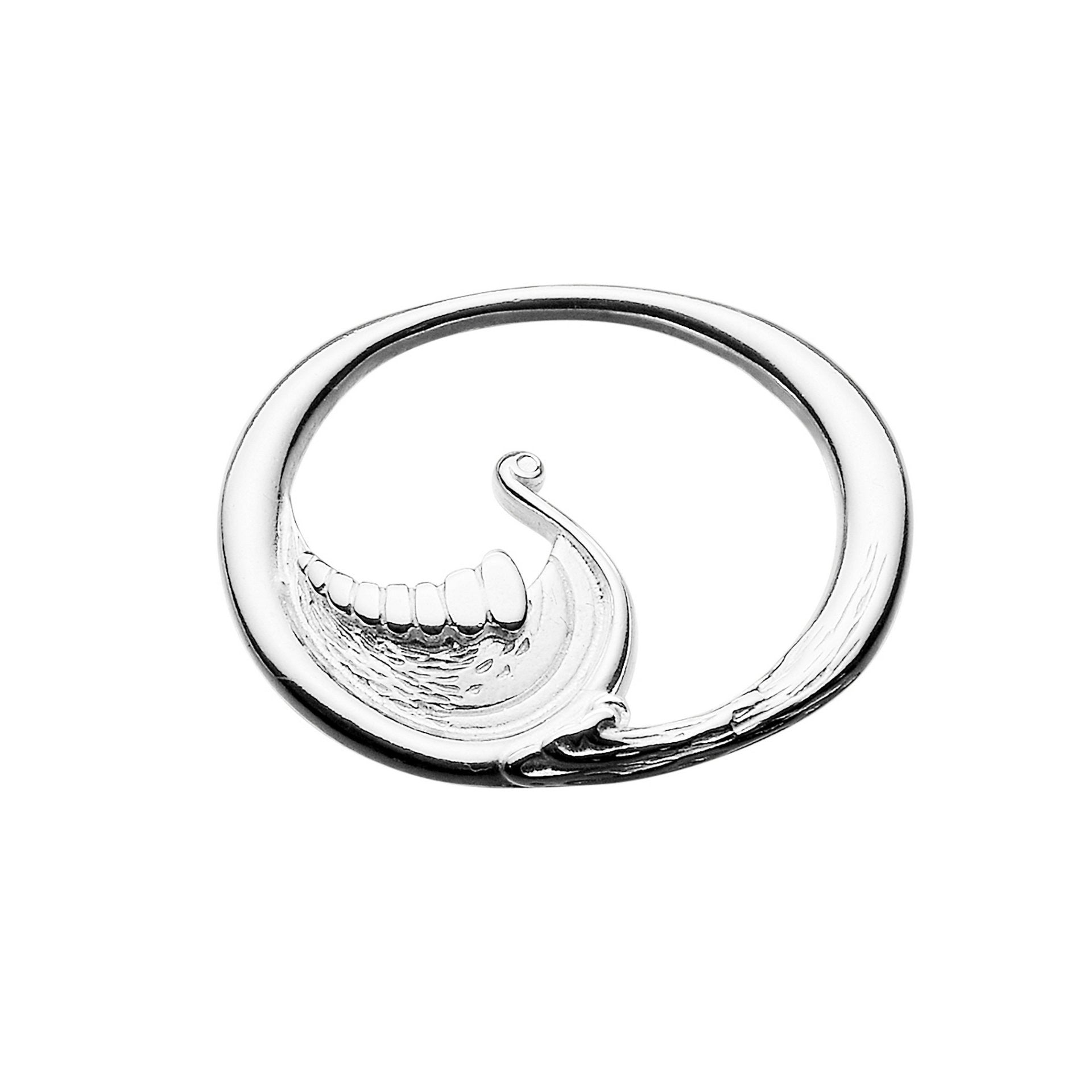 A silver brooch with an abstract design of a Viking longboat