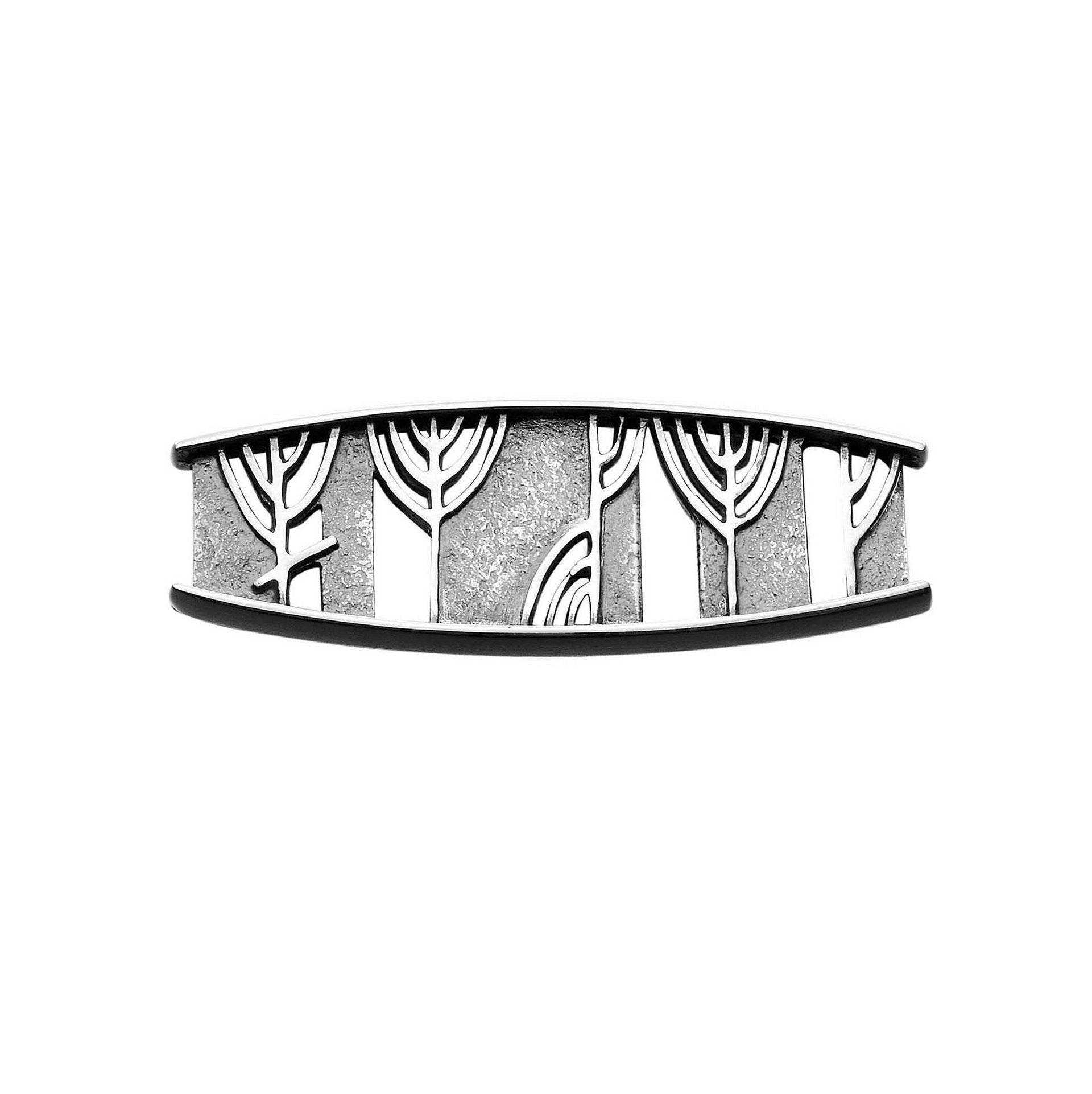 A silver brooch with detailed ruins design from the Ingibiorg Collection