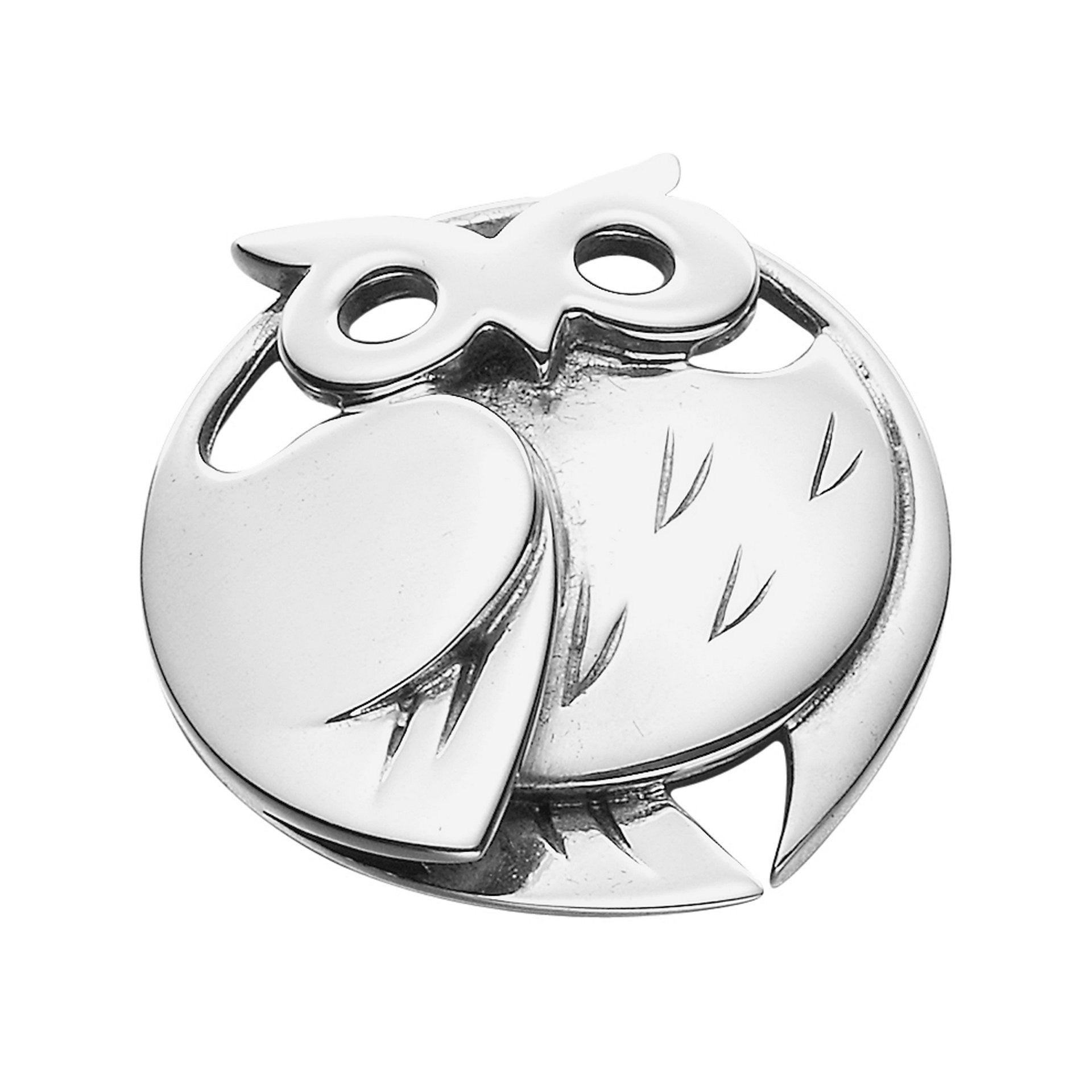 A circular silver brooch in the shape of an owl from the Barn Owl Collection