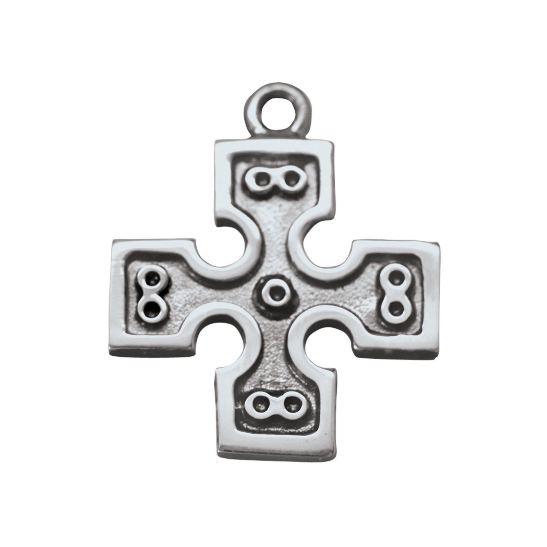 A silver charm in the shape of a cross with intricate designs and circular patterns.