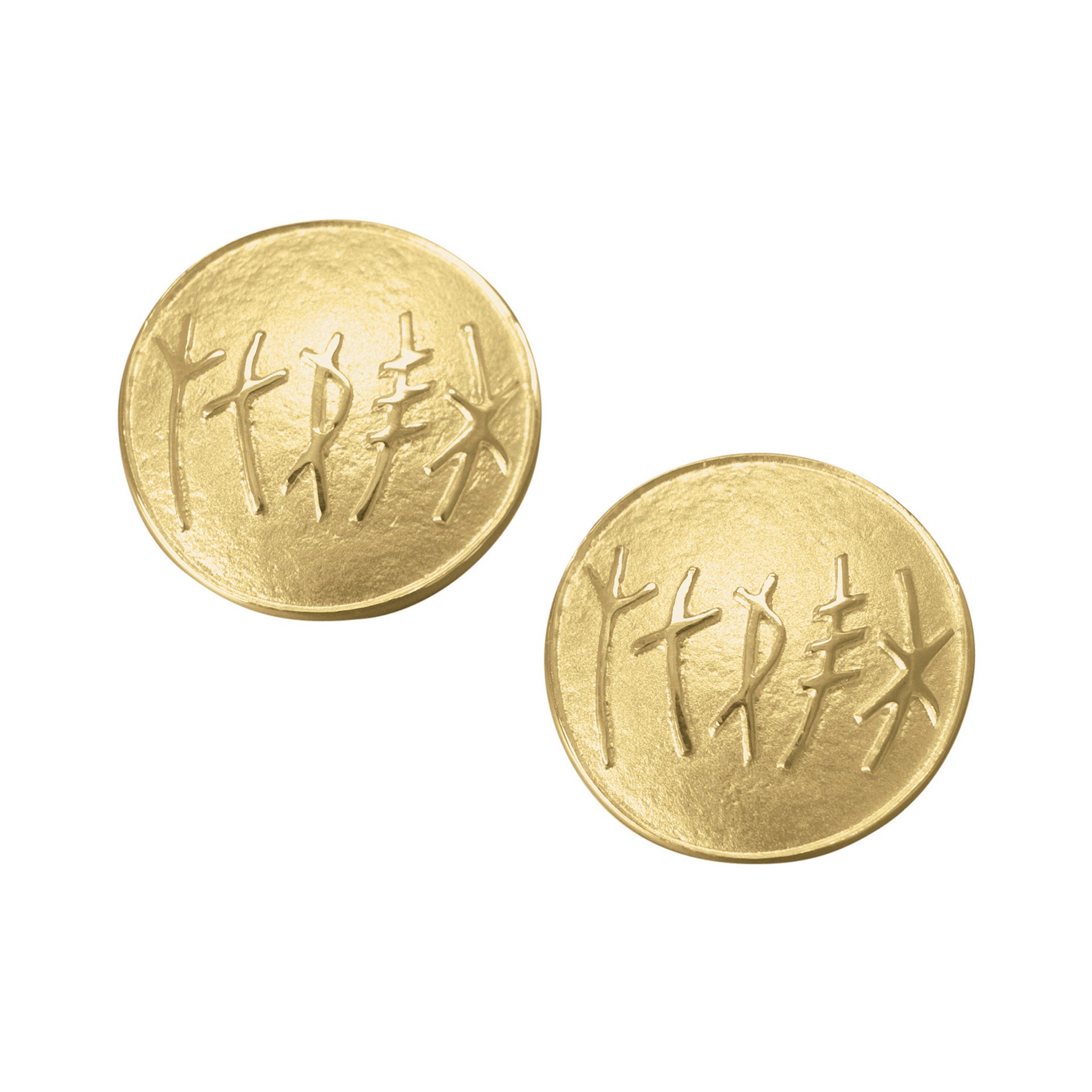 A pair of circular gold cuff links with a simple rune design