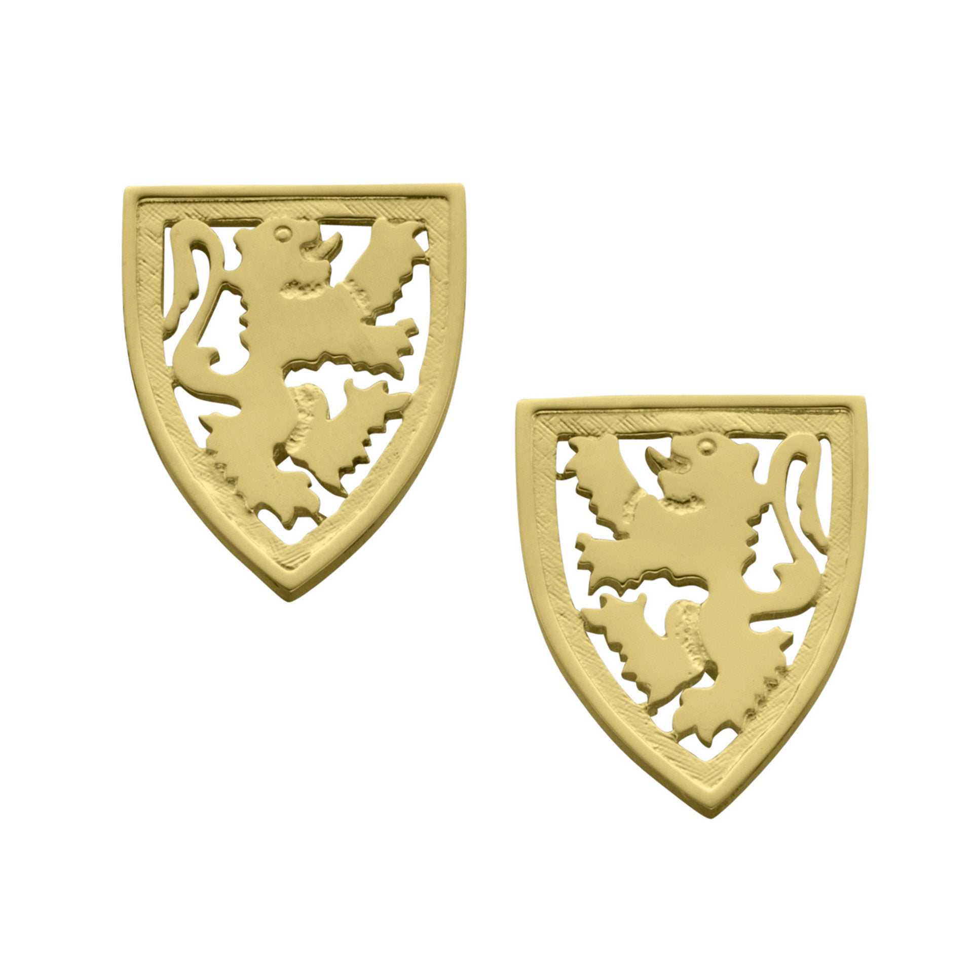 A pair of gold cuff links with intricate details of a Scottish Lion