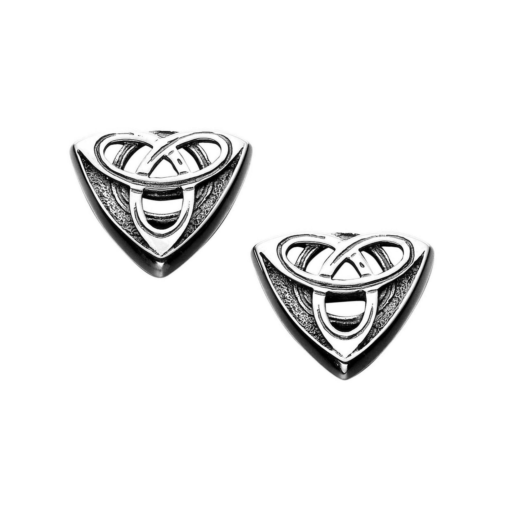 A pair of silver cuff links with an intricate geometric celtic design