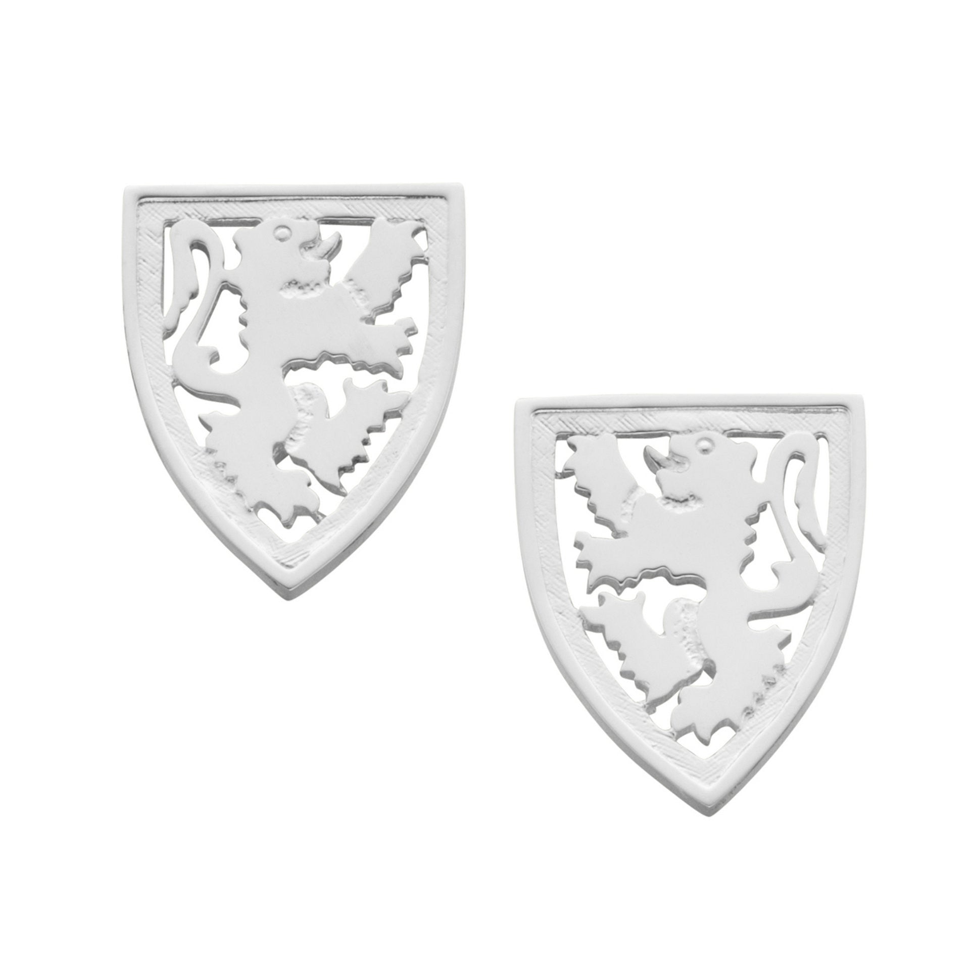 A pair of silver cuff links with intricate details of a Scottish Lion