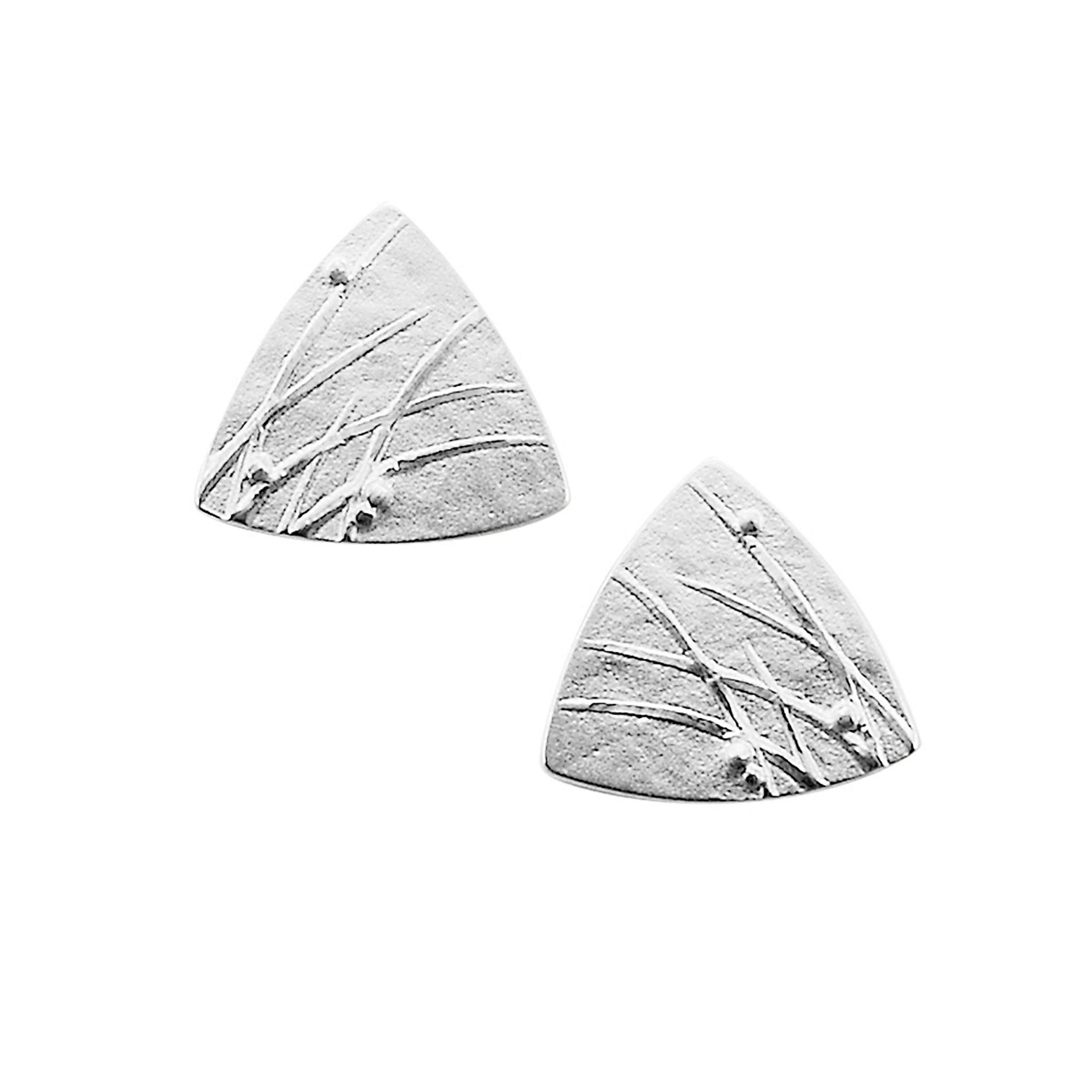 A pair of triangle silver stud earrings with a grass design from the Mistral Collection