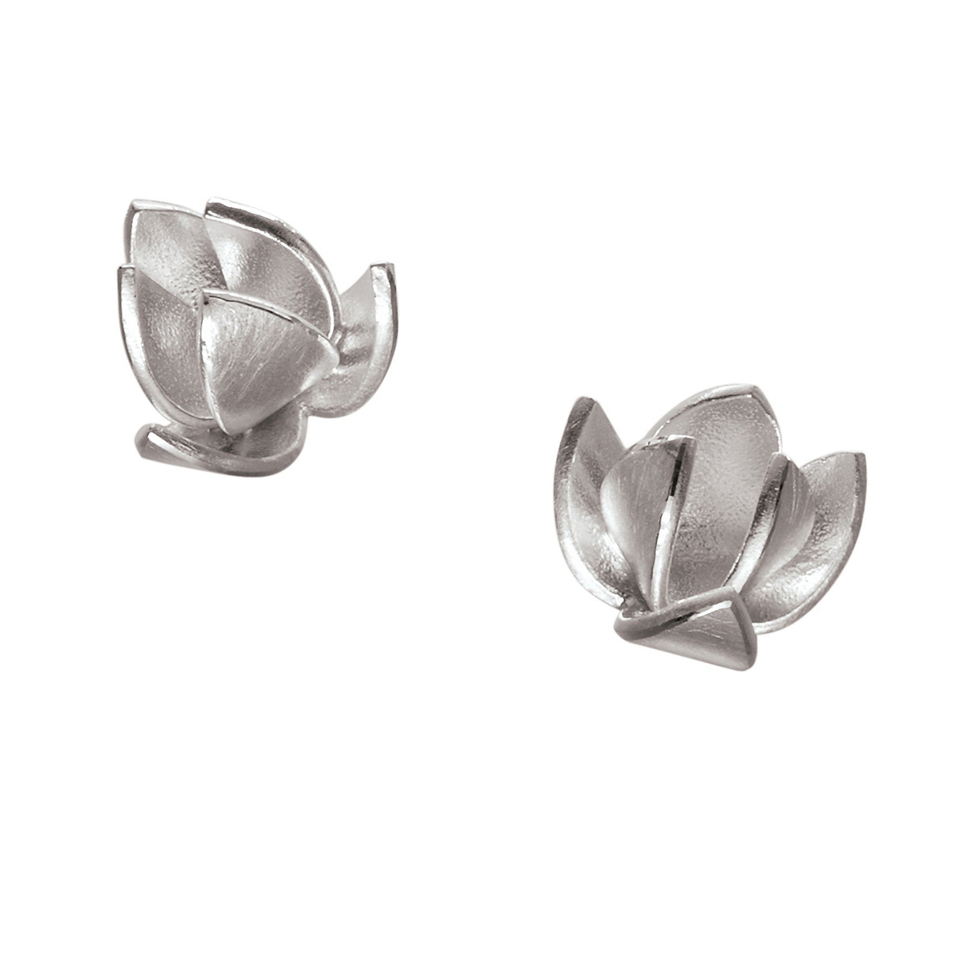 A pair of silver earrings designed to resemble little flowers