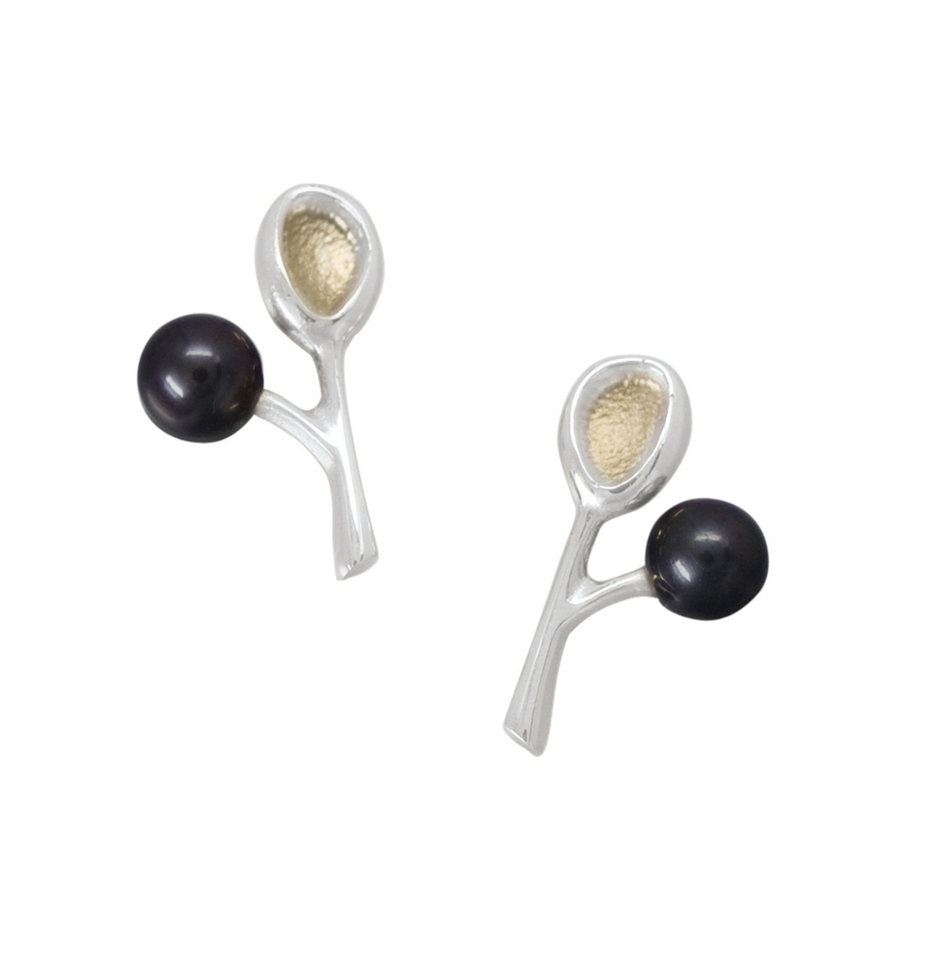 A pair of earrings featuring a silver structure with one side gold-plated, accompanied by a black pearl on each side.