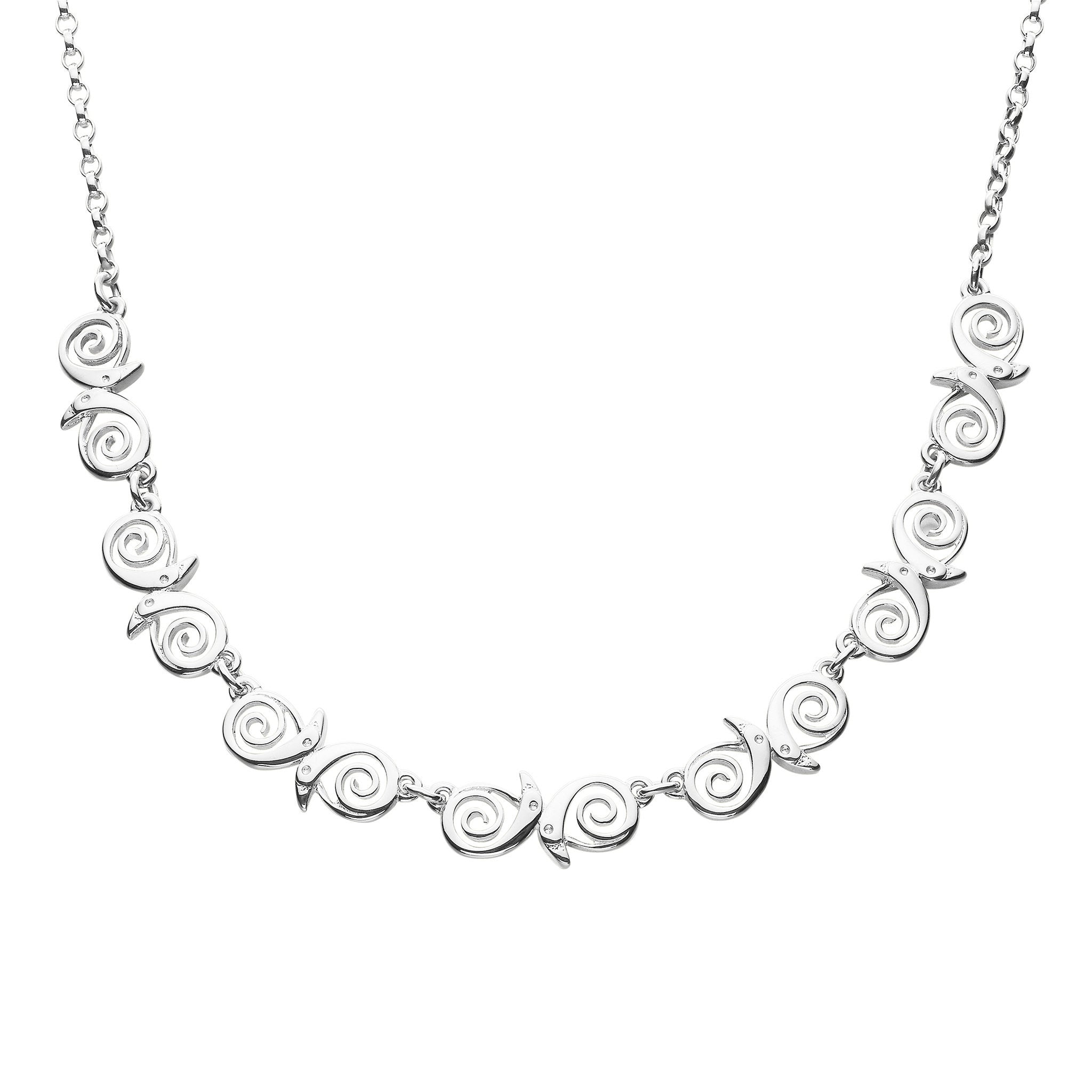 A silver necklace featuring a series of  bird designs linked together, on a white background.