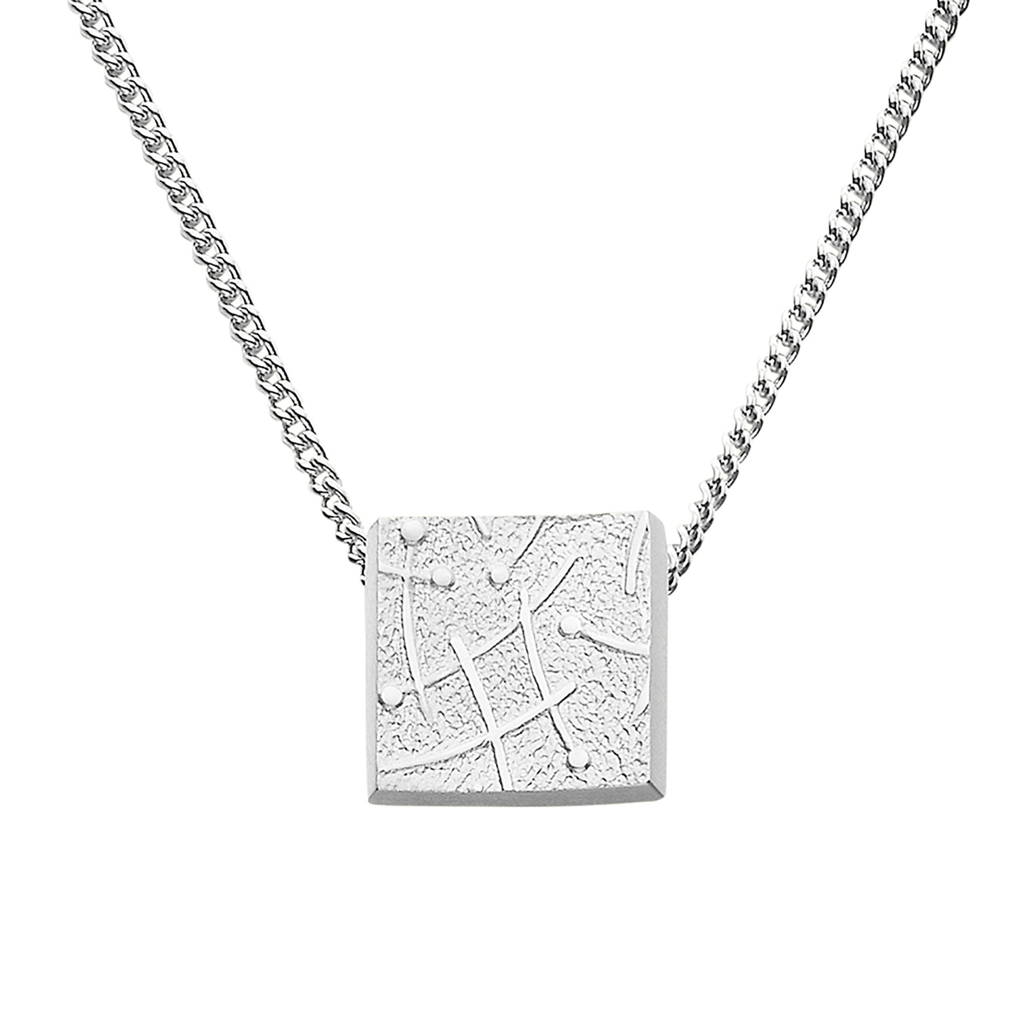 A silver necklace pendant with a geometric design, displayed on a chain.