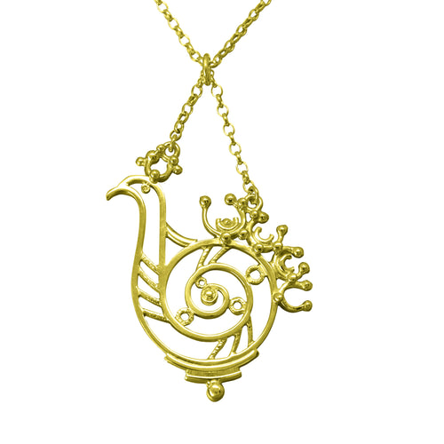 A gold necklace featuring a delicate silver pendant with a bird design