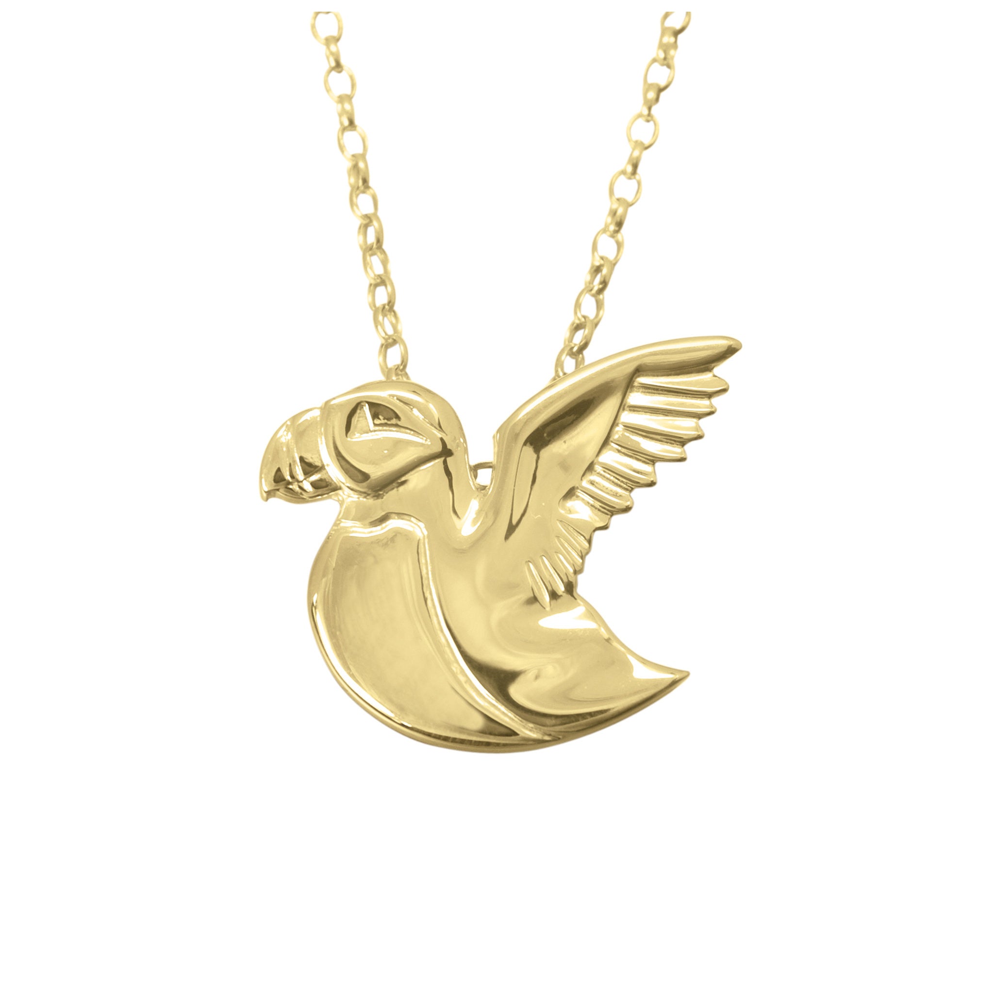 A gold necklace with a pendant shaped like a puffin in flight