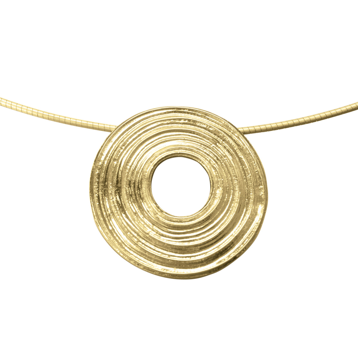 A gold necklace with a central circular patterned pendant