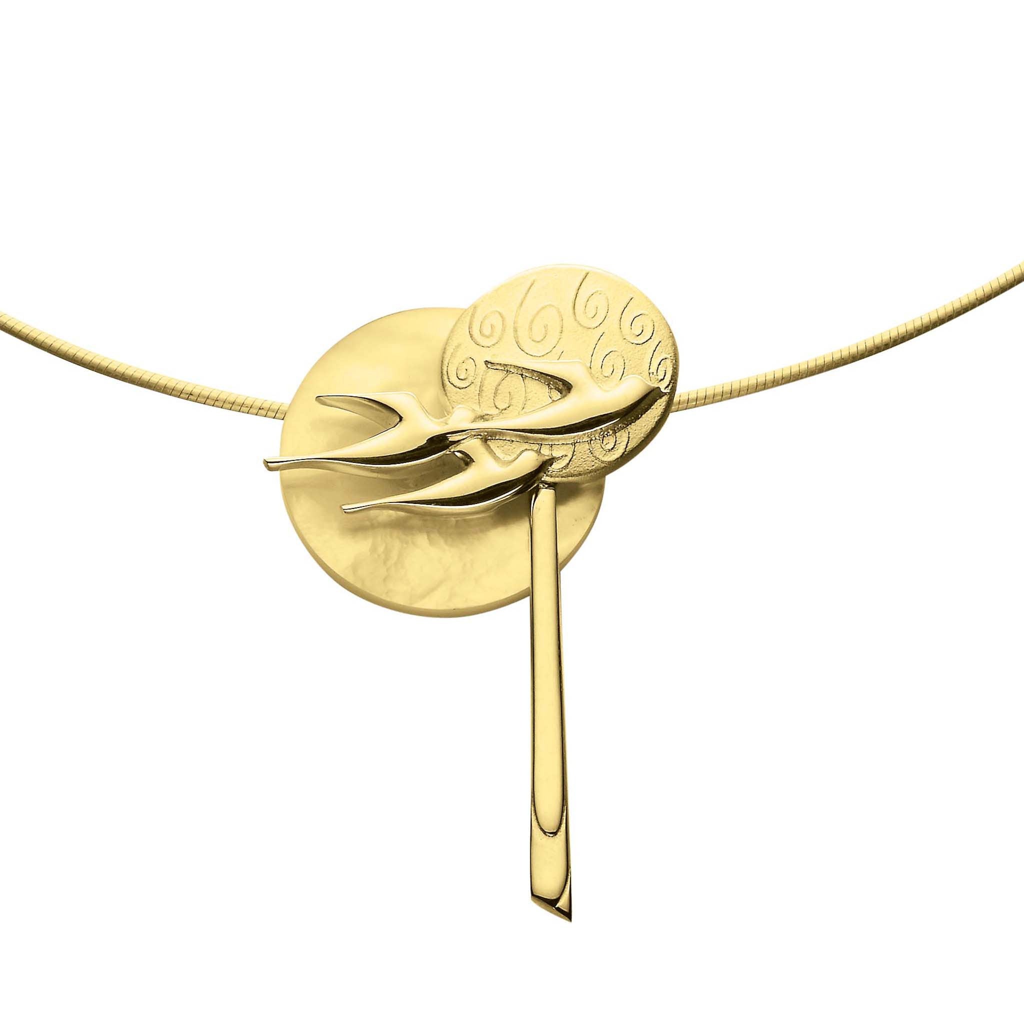 A gold pendant with multiple circle and bird design paired with a snake chain