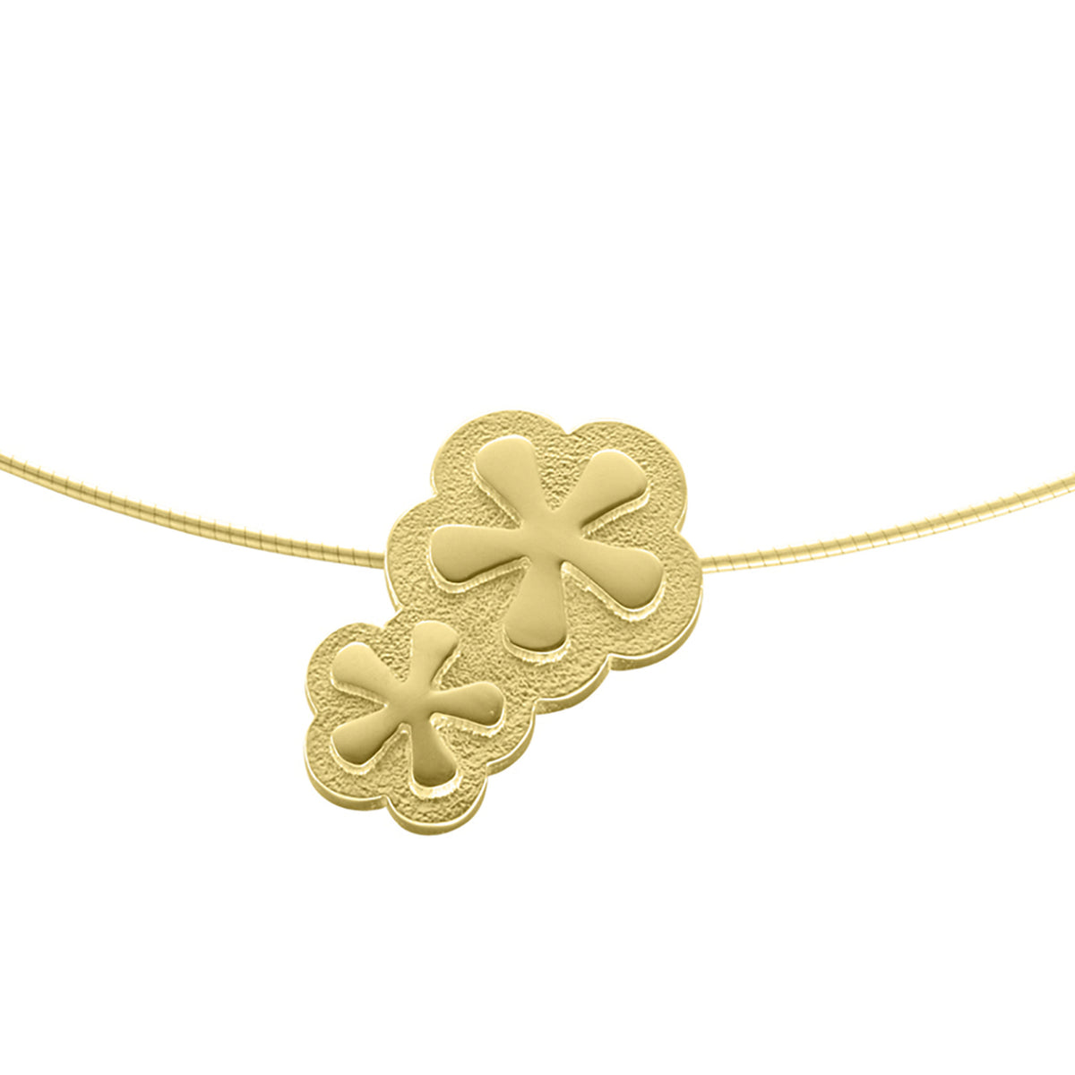 A gold necklace with a pendant that features two flowers linked to each other