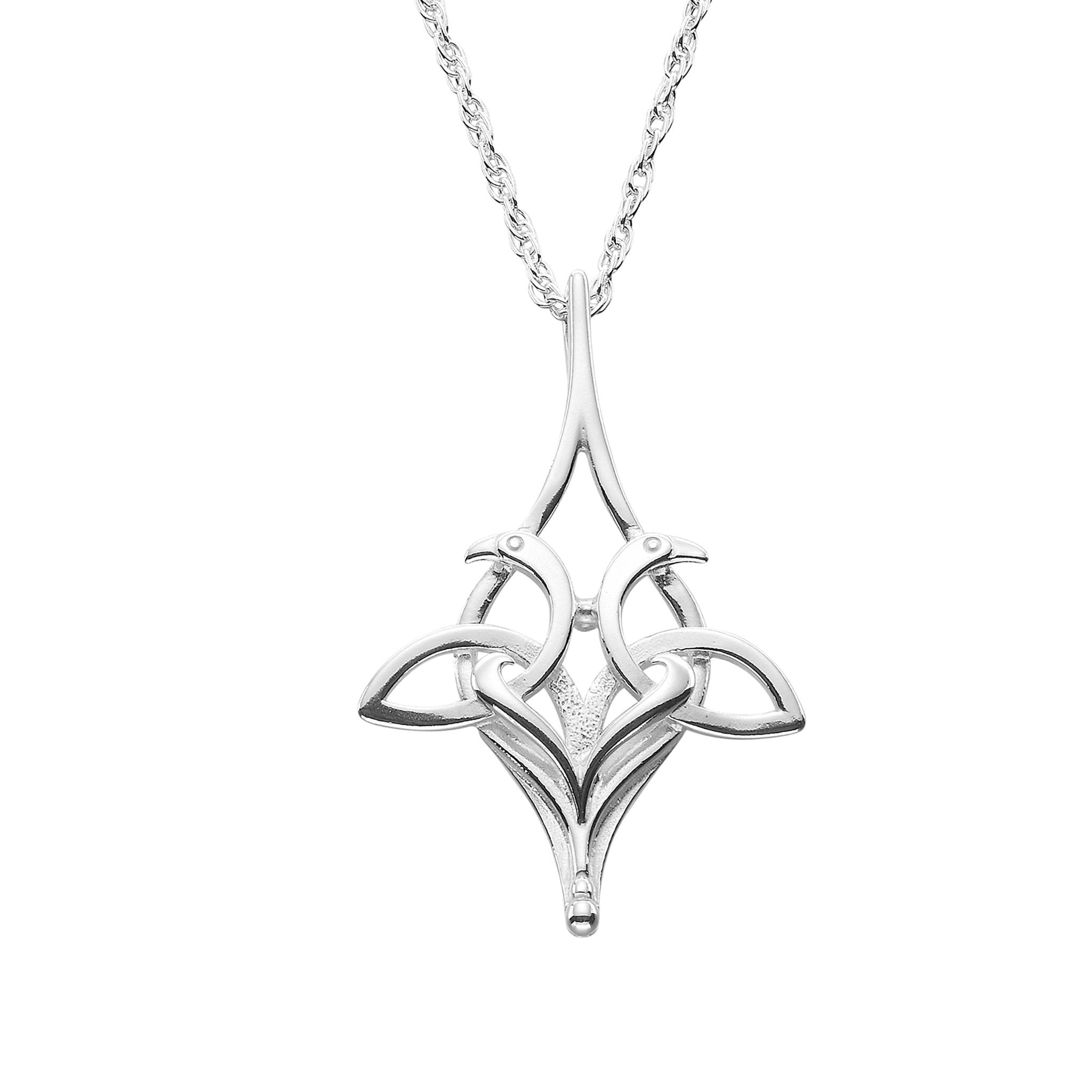 A silver pendant necklace featuring a intricate bird illustration, suspended from a chain.