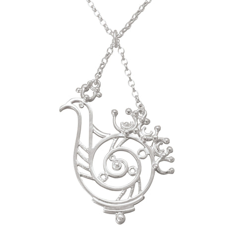 A silver necklace featuring a delicate silver pendant with a bird design
