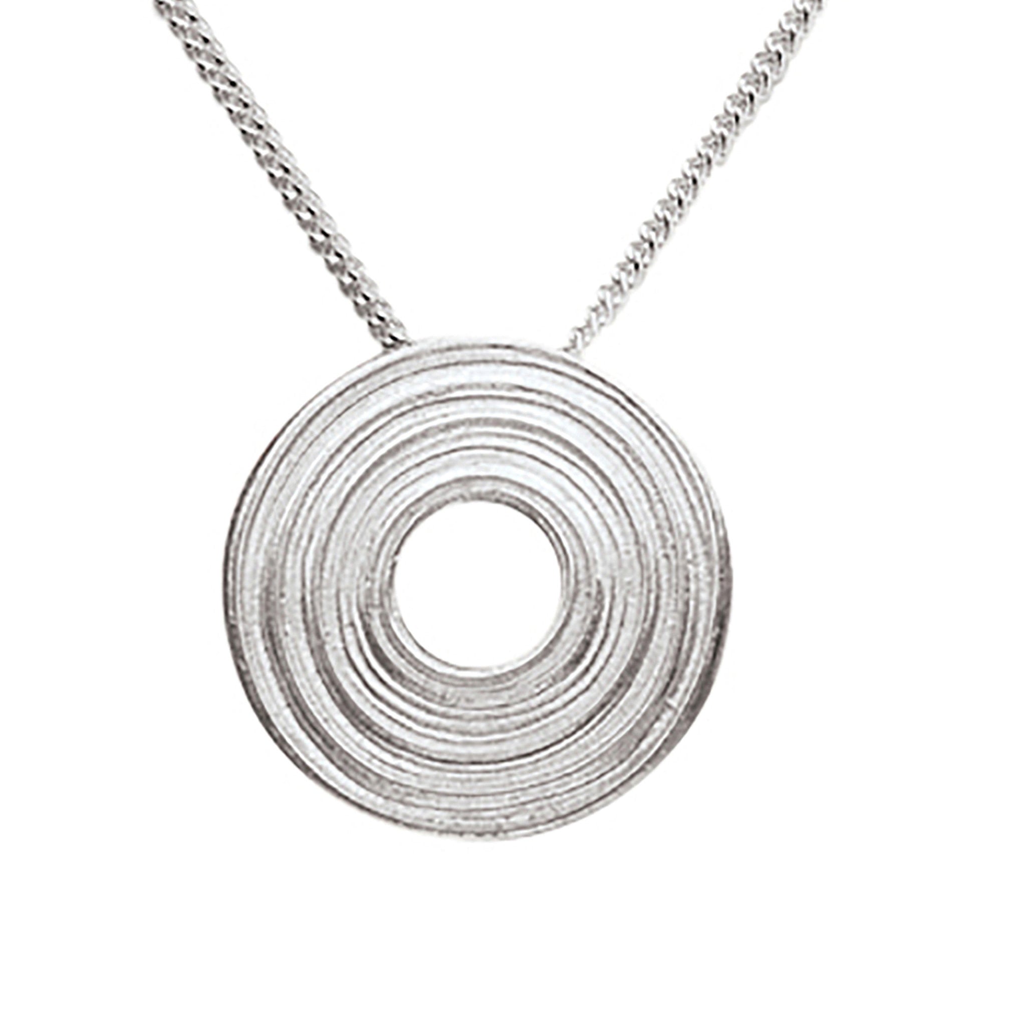 A silver necklace with a central circular patterned pendant