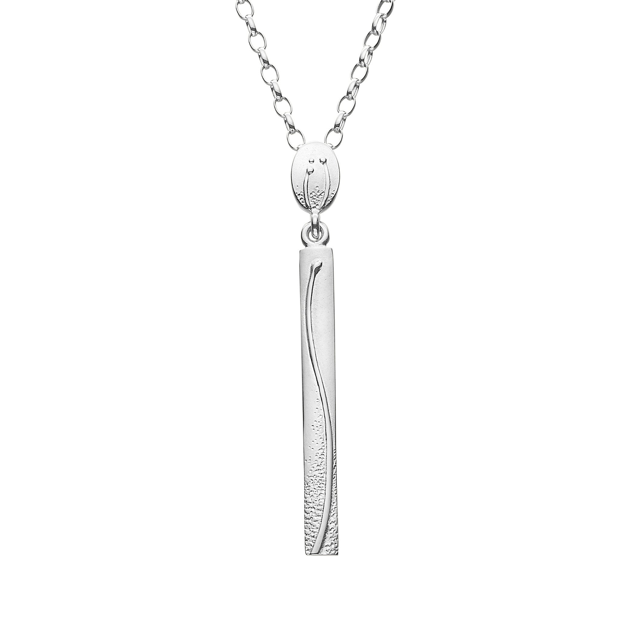 A silver pendant necklace with a long, vertical rectangular pendant, featuring a detailed pattern, displayed against a white background.