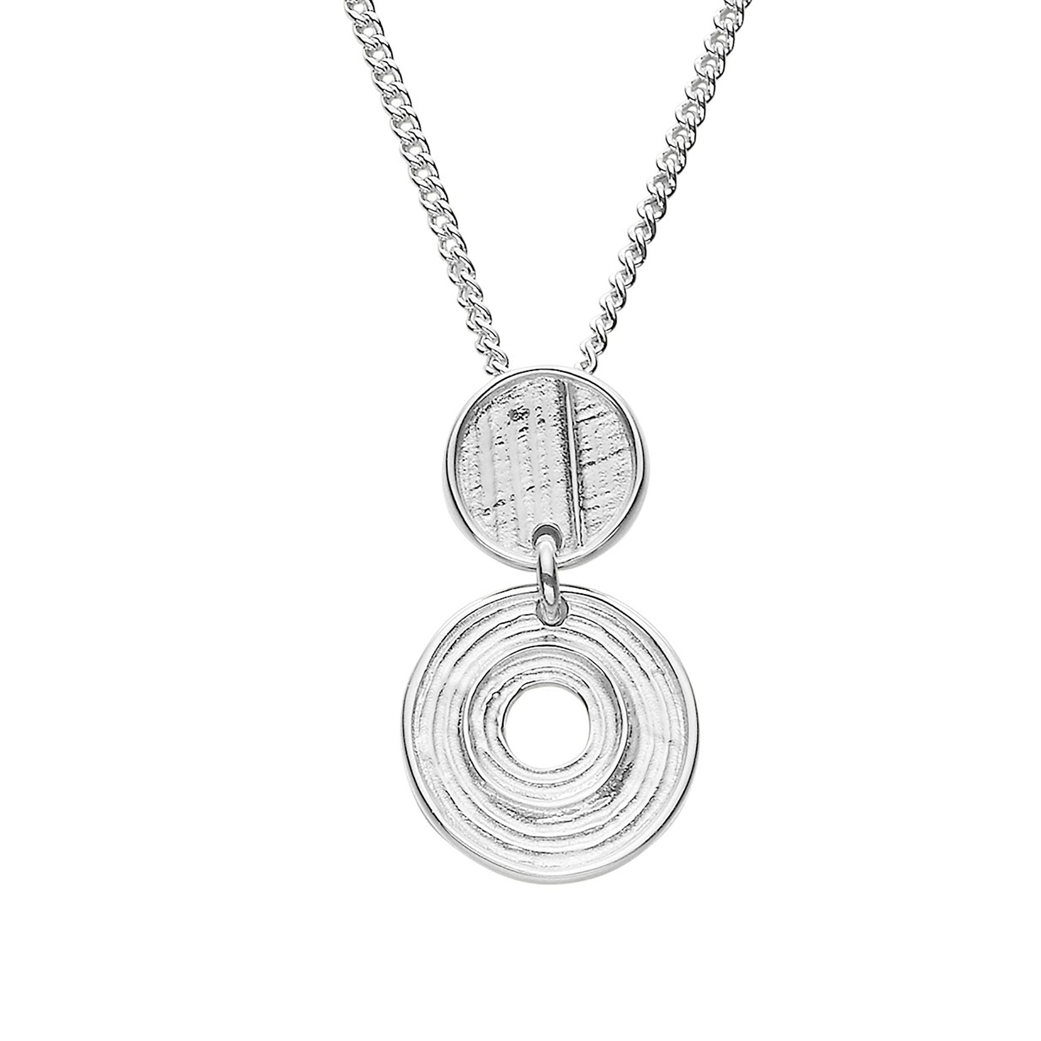A silver pendant necklace with a central circular design and a textured disc above it, attached to a curb chain.