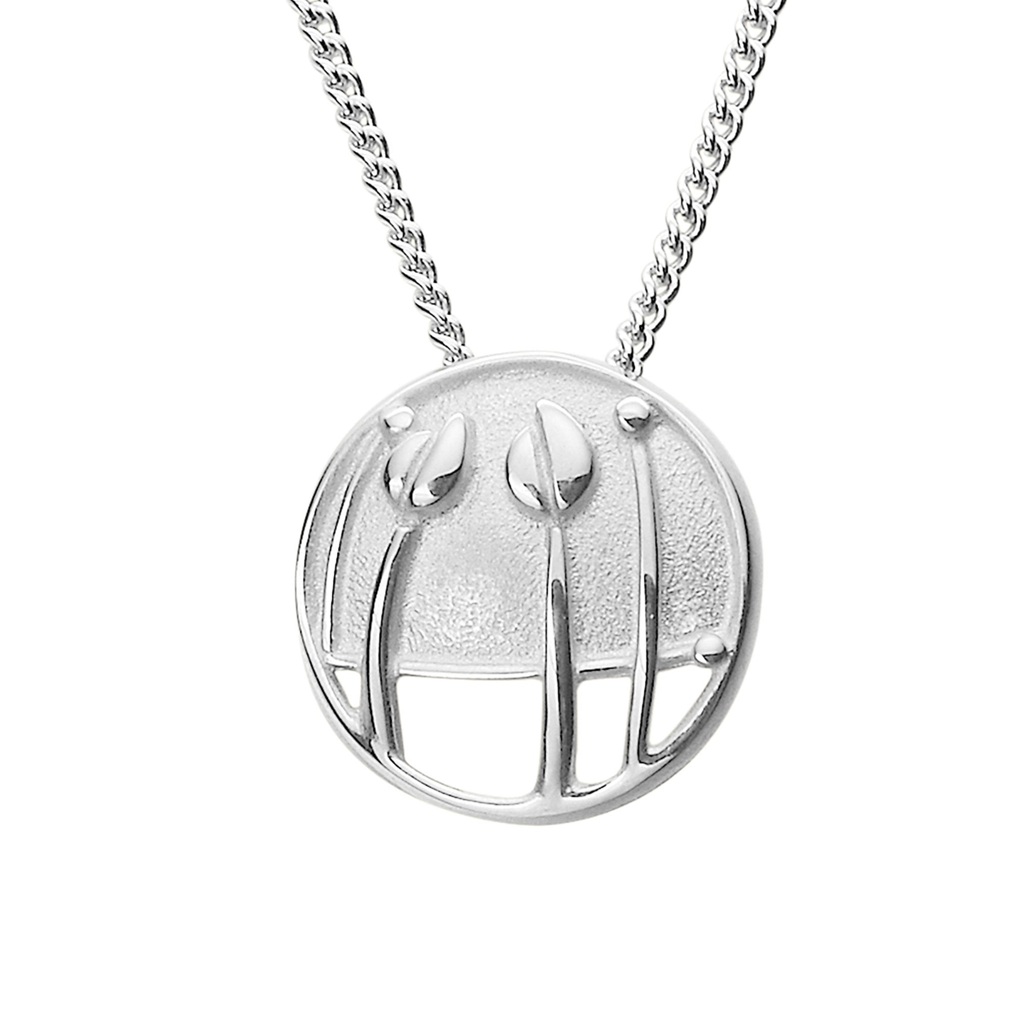 A silver pendant necklace featuring a circular design with floral elements, displayed against a white background.