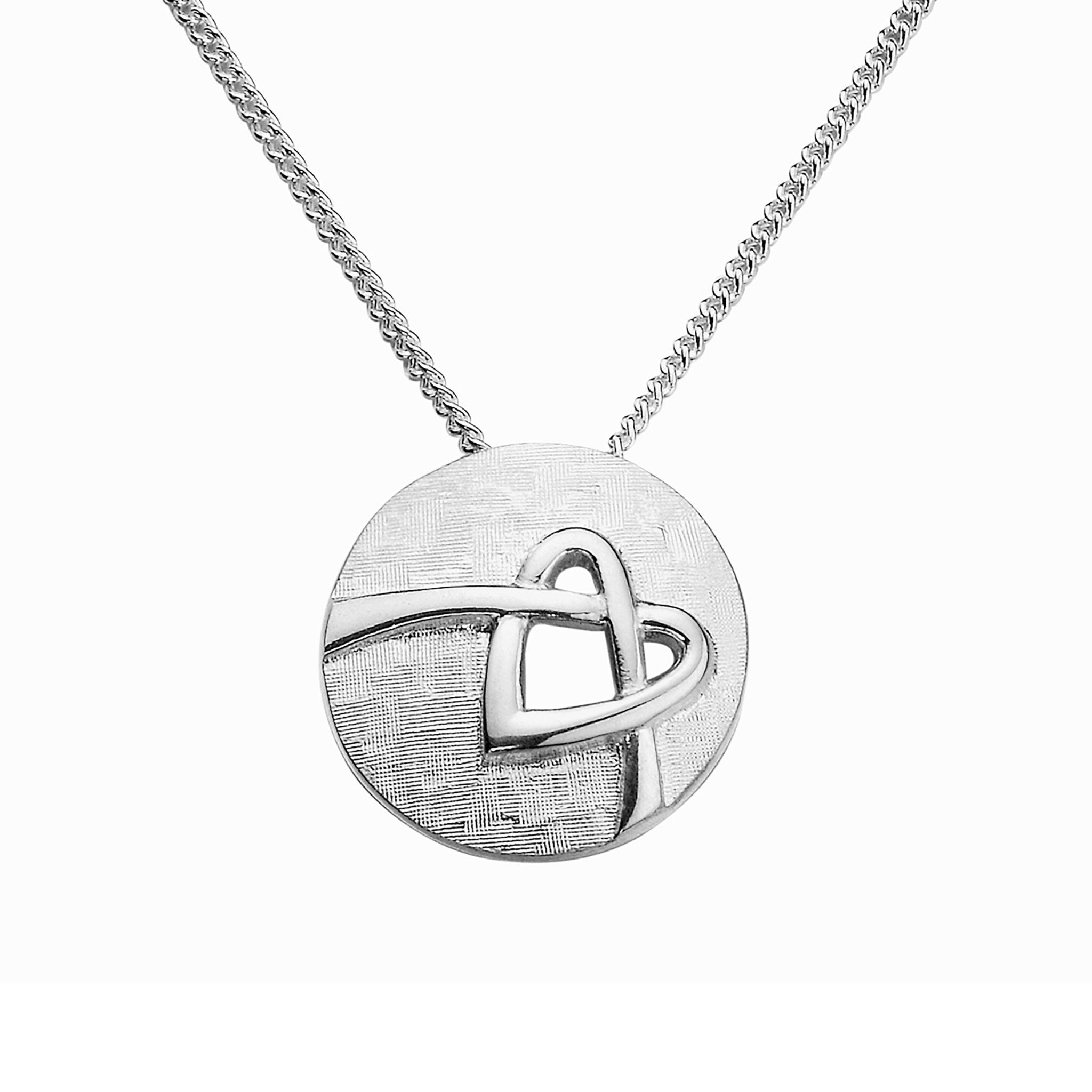 A silver round pendant necklace with a detailed design in the center, based on the Faray Large Round Pendant.