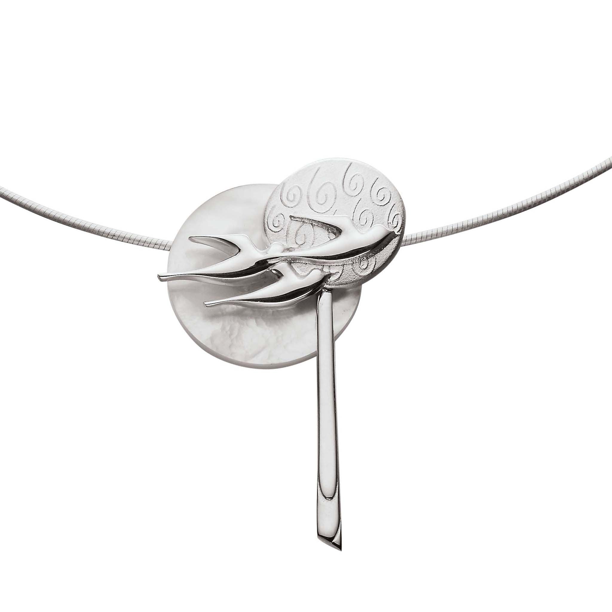 A silver pendant with multiple circle and bird design paired with a snake chain
