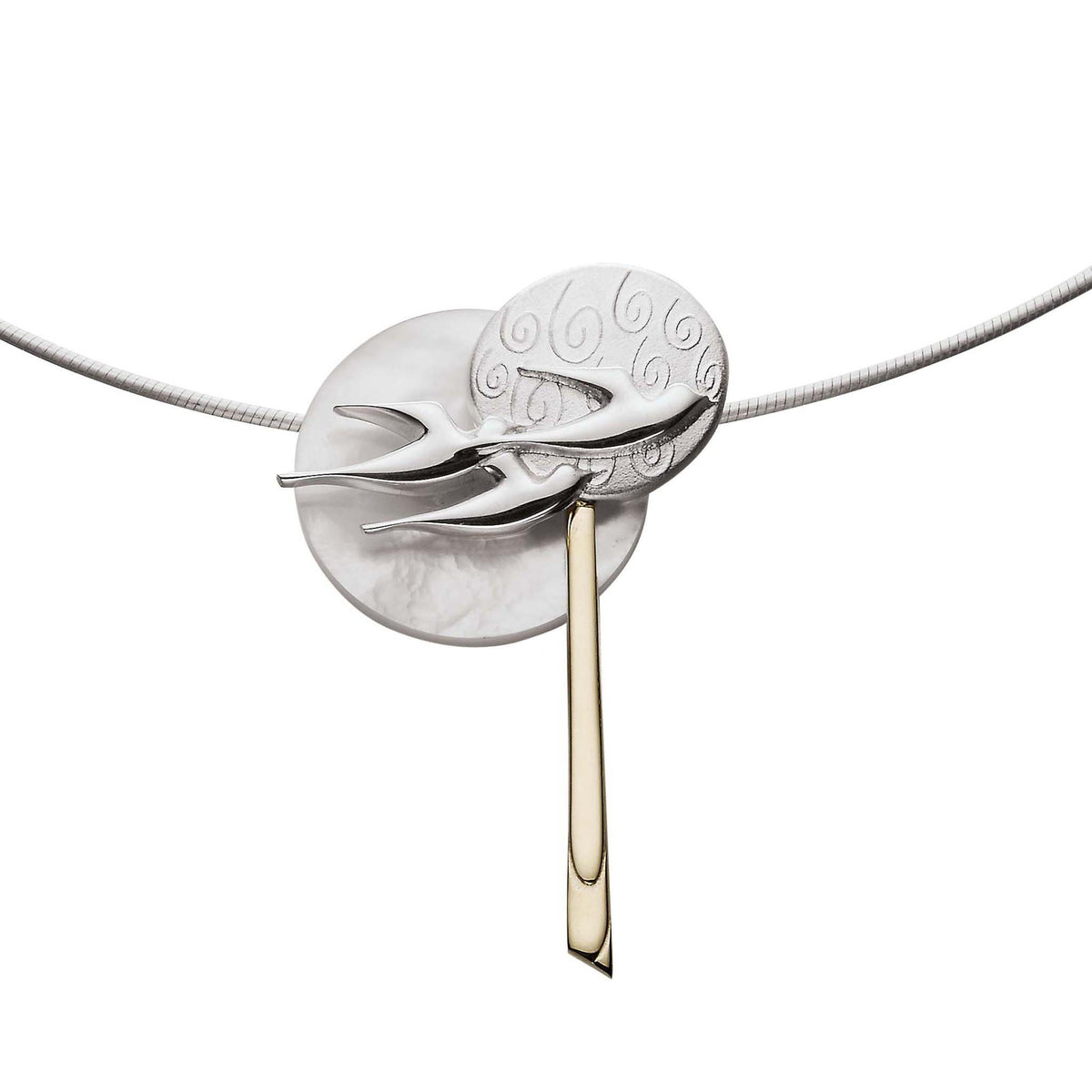 A silver and gold pendant with multiple circle and bird design paired with a silver snake chain