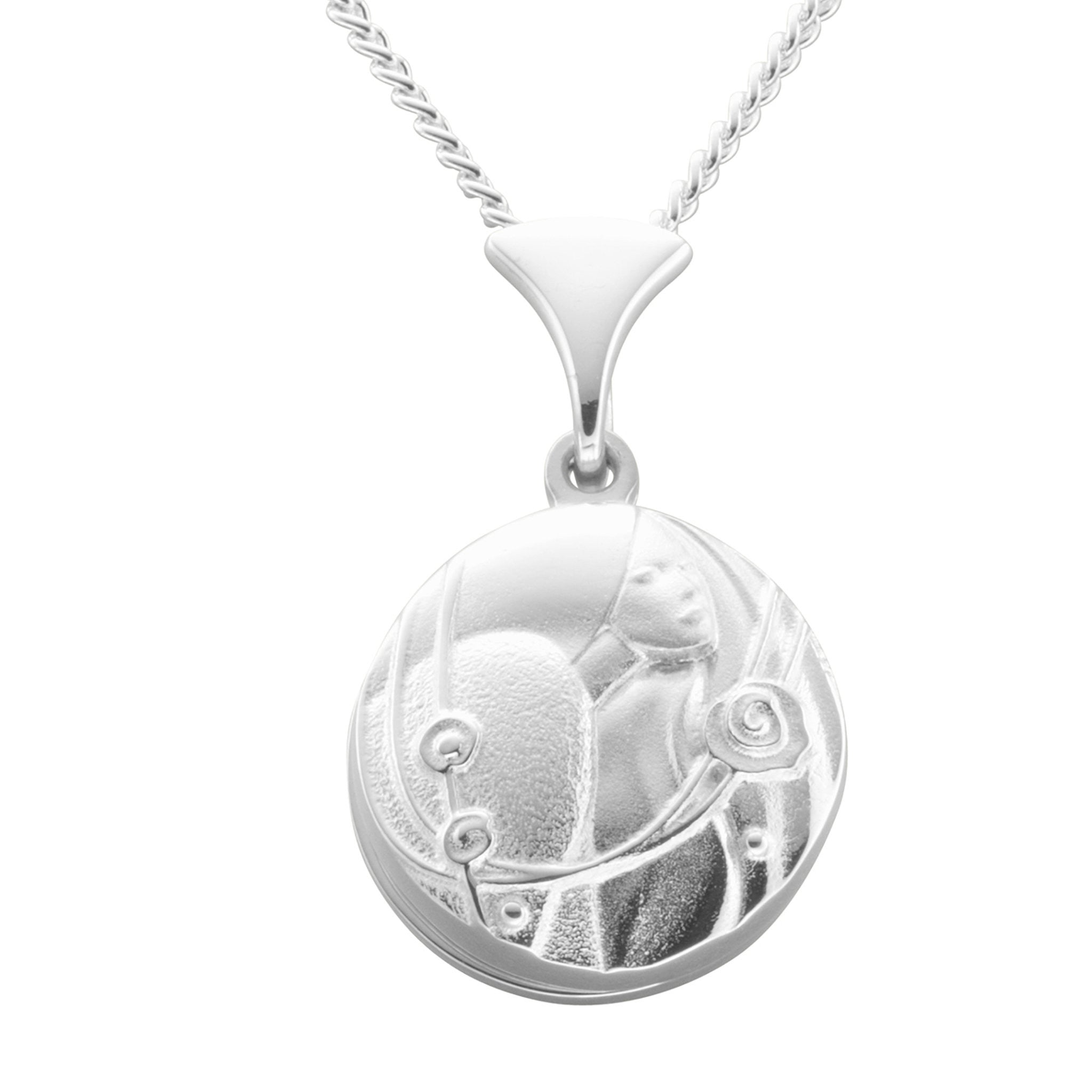 A silver necklace with a round pendant with a design featuring a lady's face and roses