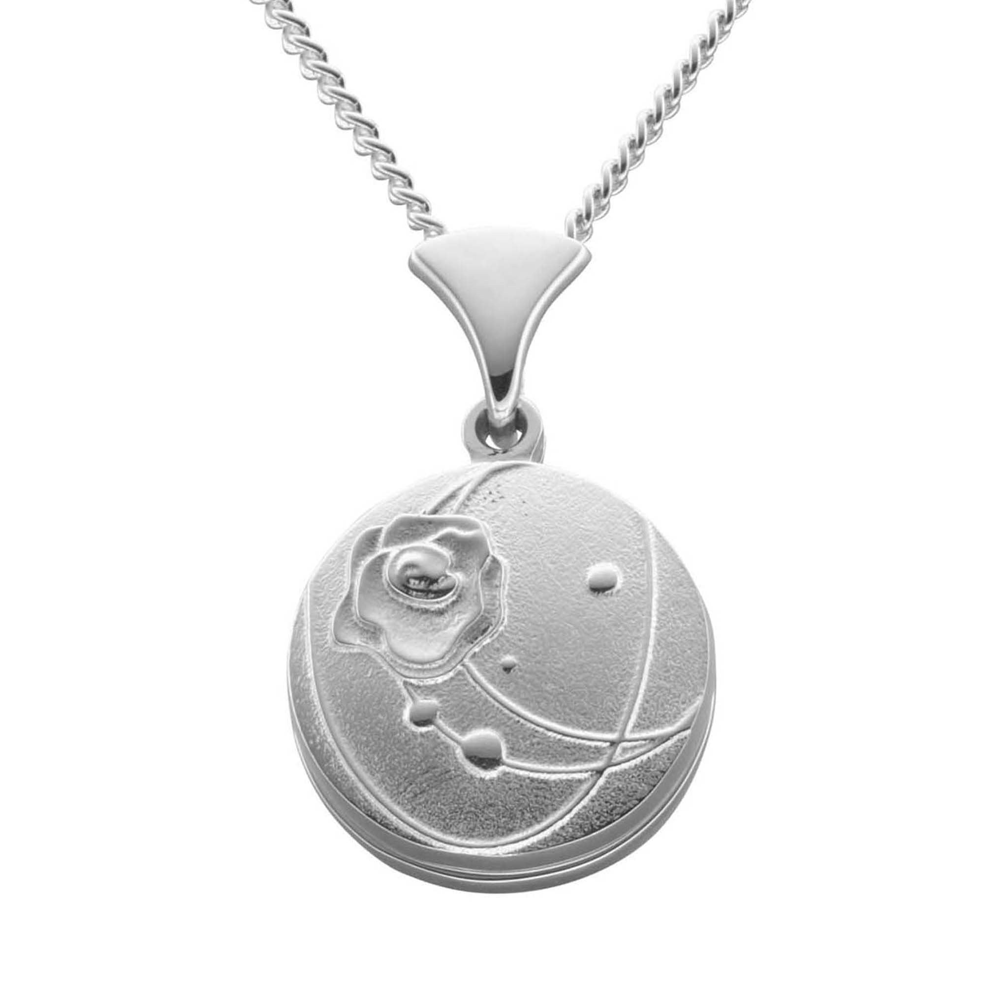 A silver necklace with an round pendant that has a simple design featuring roses