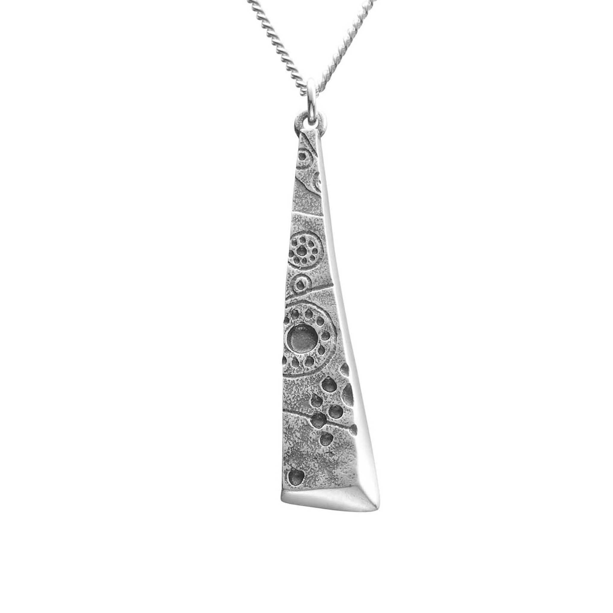 A long triangular silver pendant with a geometric pattern, suspended by a chain.