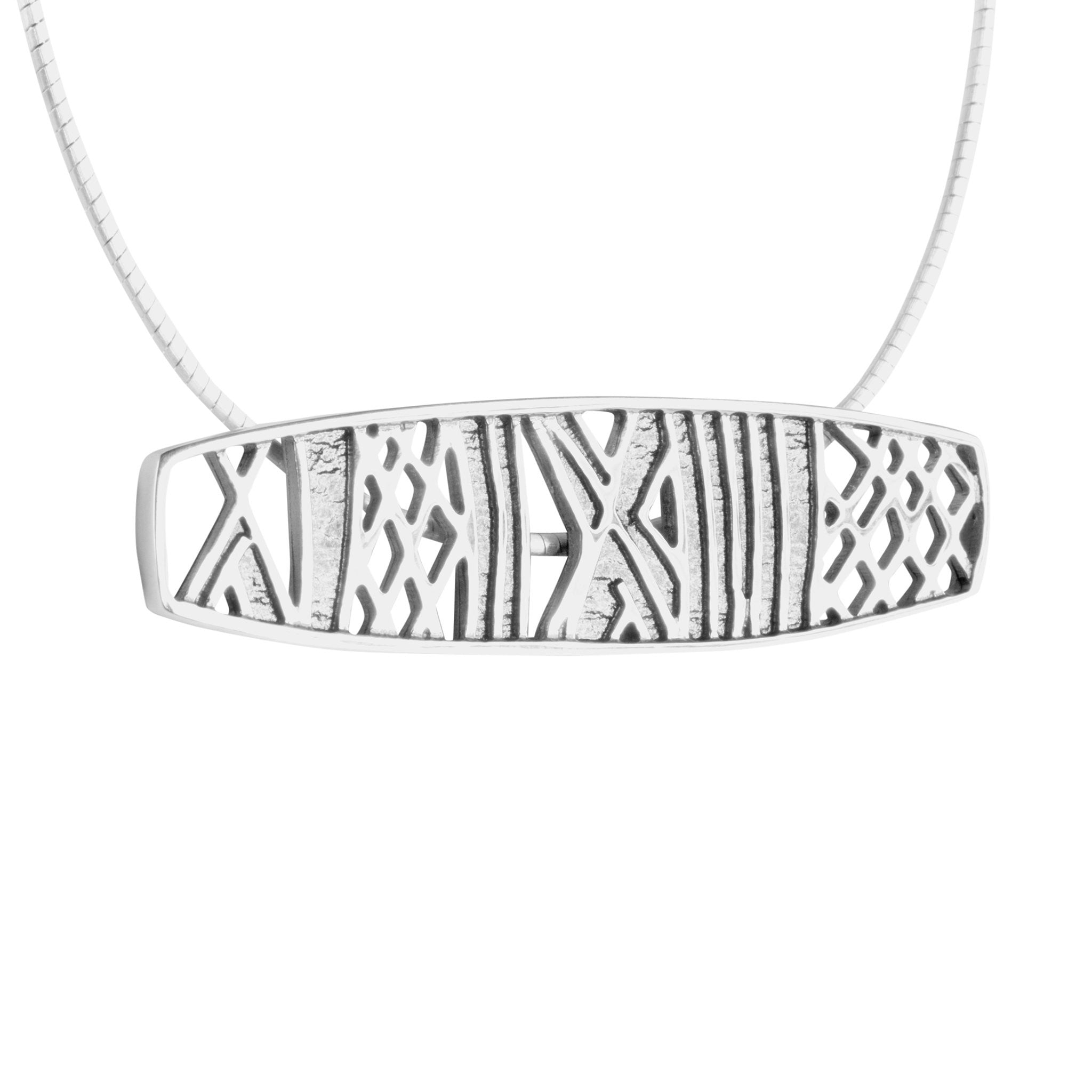 A large rectangular pendants in silver with rune designs, part of the Ness of Brodgar collection